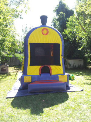 Bounce, Climb, Slide & Shoot Hoops, With This Choo-Choo Train 4 in 1 Combo use as a Water or Dry Slide too!  Photo of front entrance.